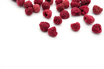 Home cooked, dehydrated raspberry berries. Dried, organic raspberries. Abstract background of raspberry chips - superfood, berry fruit dessert on the white desk. 