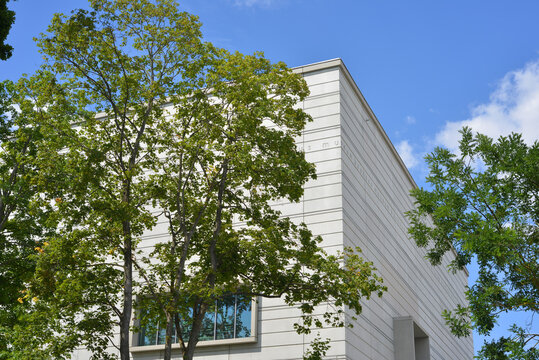 Weimar, Germany, Bauhaus Museum architecture with trees and inscription on the facade