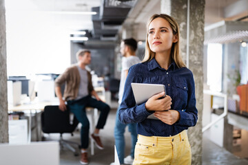 Programmers cooperating at IT company developing apps