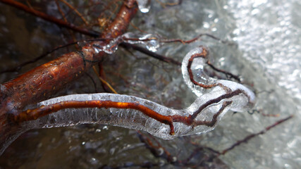 Beautiful icicles on a frozen mountain stream
