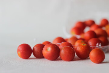 Cherry tomatoes packed in a transparent plastic box.