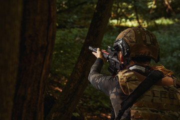 Fototapeta premium Woman in helmet and uniform working soldier