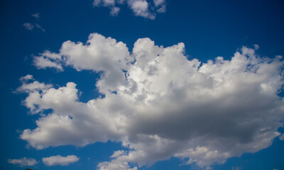 Summer sky with cumulum clouds.