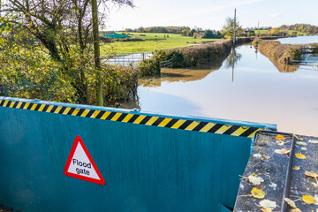 A flood gate in the Severn Vale holding back the River Severn at Deerhurst, Gloucestershire UK on...