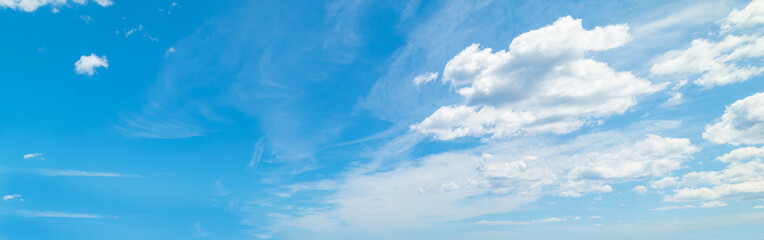 Naklejka na ściany i meble Blue sky with soft clouds in summertime