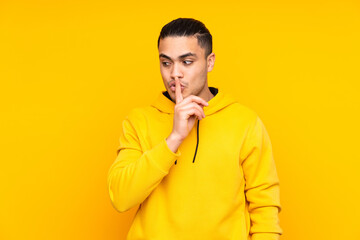 Fototapeta na wymiar Asian handsome man isolated on yellow background yawning and covering wide open mouth with hand