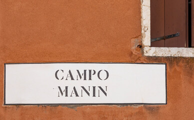 signage campo Manin - area of Manin - in Venice at an old grunge house wall in Venice