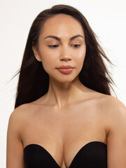 Close-up portrait of a beauty woman with full lips, straight hair and perfectly clean skin. Daytime makeup, styling and soft care. Skin care in the spa salon or cosmetology, smooth eyebrows