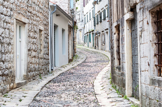 Narrow cobblestone street at Risan town of Montenegro.