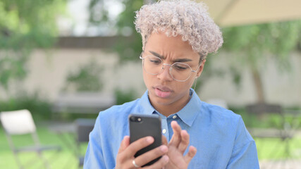 Portrait of African Woman using Smartphone