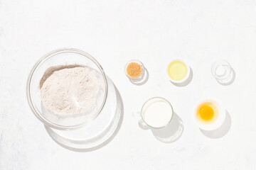 Obraz na płótnie Canvas Pancakes recipe step-by-step ingredients whole grain flour egg oil sugar milk