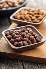 Peeled hazelnuts and almonds. Sweet nuts.