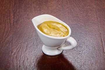 Traditional mustard sauce in the bowl