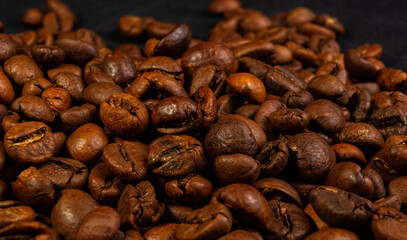 Natural background for Cafe menu or brochure template - macro photo of brown roasted coffee beans, close up