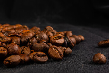 Natural background for Cafe menu or brochure template - macro photo of brown roasted coffee beans, close up