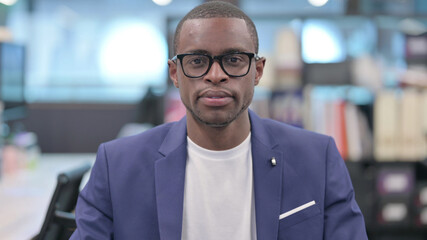 Portrait of Young African Businessman Looking at Camera