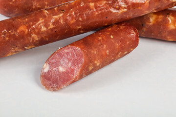 Pork ham sausage cut isolated