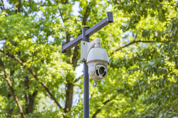 Outdoor security camera an iron pillar in the public park