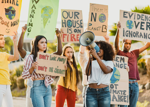 Black woman encouraging protesters during ecological strike