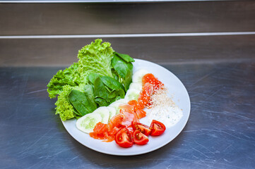Fresh freshly prepared salad with tomatoes, herbs and meat