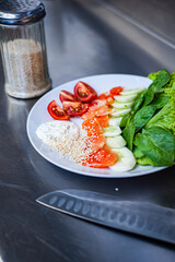 Fresh freshly prepared salad with tomatoes, herbs and meat