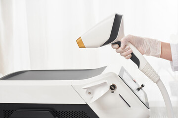 Fototapeta premium Laser epilation and cosmetology in beauty salon. Hair removal procedure. Laser epilation, cosmetology, spa, and hair removal concept.