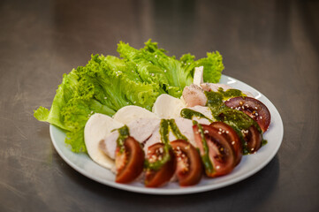 Fresh freshly prepared salad with tomatoes, herbs and meat
