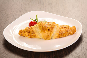 Sweet croissant in the plate