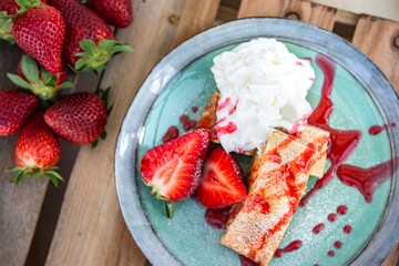 apple dessert with strawberries and whipped cream