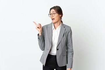 Business Ireland woman isolated on white background intending to realizes the solution while lifting a finger up
