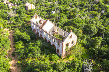 Aerial view above scenery of Curacao, the Caribbean with old ruins in mountains