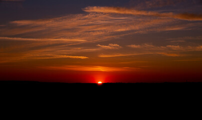 sunset On the horizon of a hill