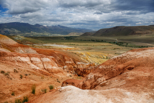 Martian landscape in the mountains of the Altai Republic in Russia. The landscape is made of red and orange rocks. Travel photo from a summer trip.
