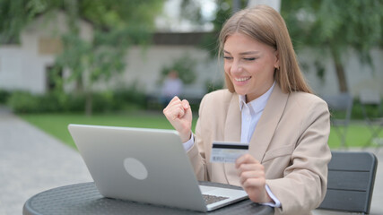 Successful Online Payment on Laptop by Businesswoman 