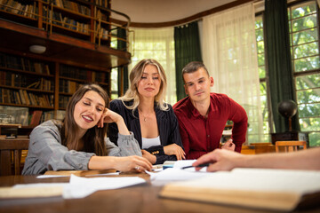 Group of students studying together at the University library