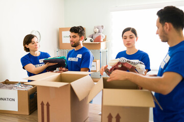 Arranging second-hand clothes on boxes