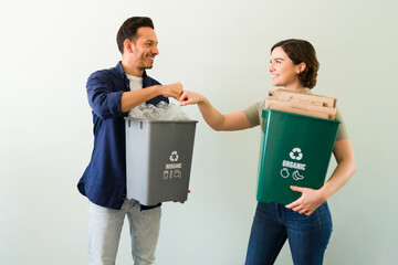 Attractive couple proud of their recycling activity - Powered by Adobe