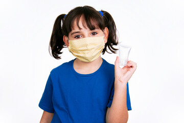girl child shows alcohol gel, covid fabric mask, flu, health care