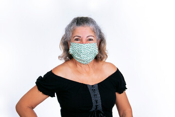 elderly woman wears fabric mask for protection covid, flu, health care, personal care, elderly in adaptation care covid-19, new normal