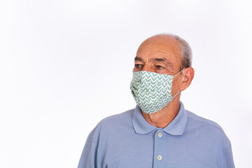 elderly man wearing covid protective fabric mask, on white background.