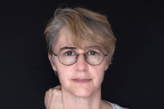 Portrait Of A 50 Year Old Woman With Glasses
