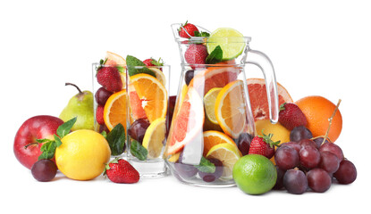 Jug and glasses with different fruits on white background