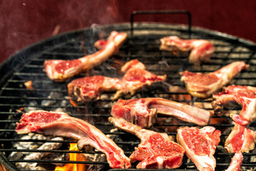 lamb chops with coarse salt on the charcoal grill. Festive summer outdoor dining concept