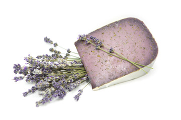 Organic cheese with lavender flowers isolated on white background. Lavender food products.	