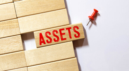 assets word written on wood block, business concept