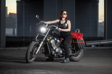 Foto op Plexiglas Girl biker sexually posing on motorcycle at night city © horimono