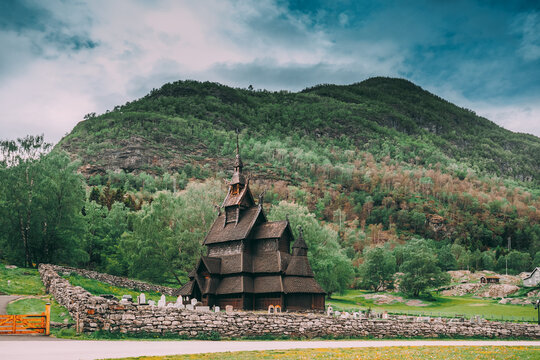Borgund, Norway. Famous Landmark Stavkirke An Old Wooden Triple Nave Stave Church In Summer Day. Ancient Old Wooden Worship In Norwegian Countryside Landscape