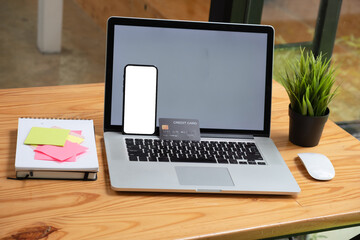 Top view of workspace with Online payments concept, Smartphone blank screen for advertisement with...