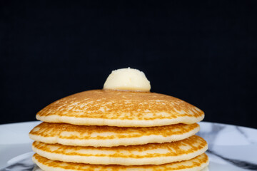 Hot pancakes with butter on top
