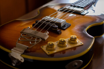 Brown guitar on the table